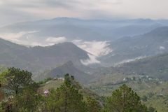 Cloud-filled valley in the Himalayan foothills